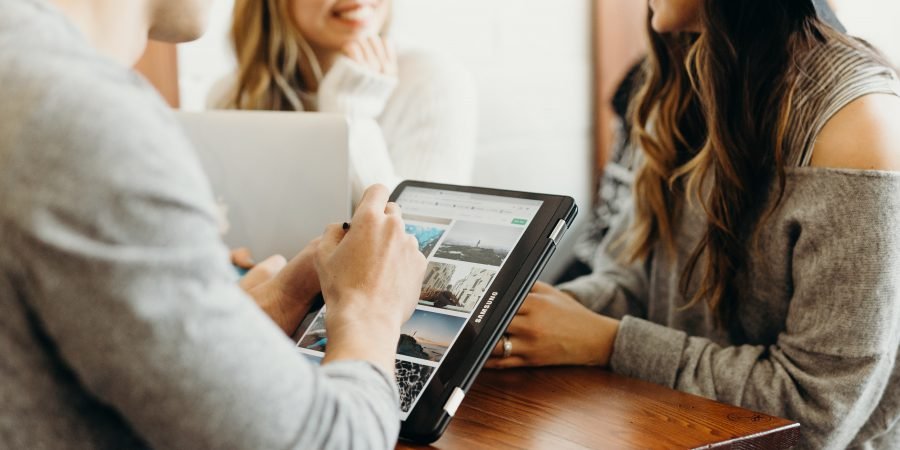 Two women looking at a laptop